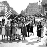 ** FILE ** French civilians with their hastily made American and