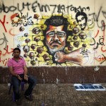 Mohammed Morsi in un graffito al Cairo-VOA